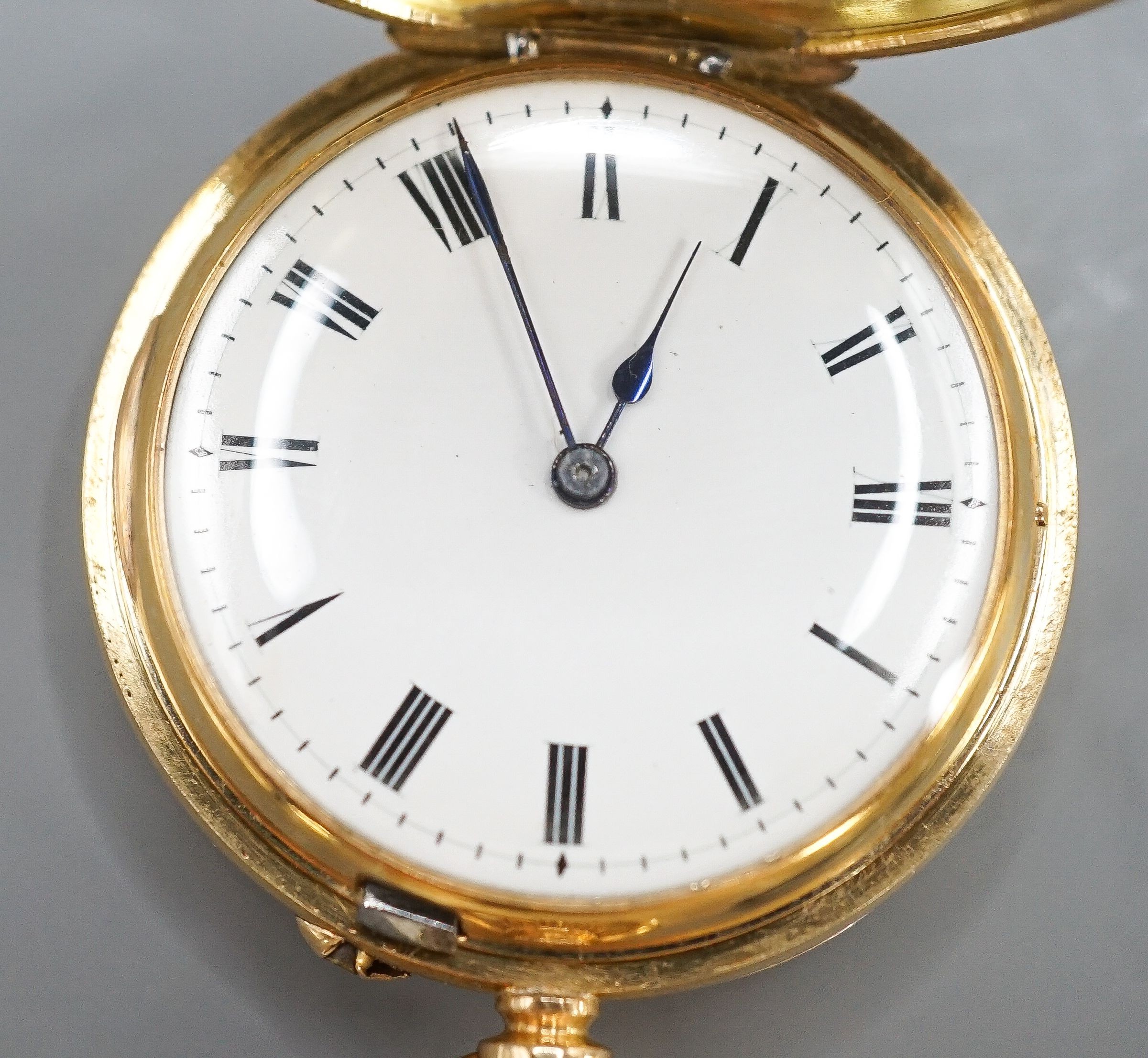 An Edwardian 18ct gold and guilloche enamel half hunter fob pocket watch, case diameter 35mm, gross 47.3 grams.